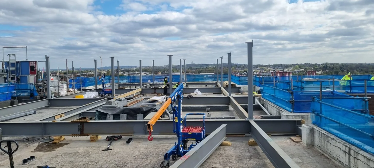 Structural steel columns installed at roof level