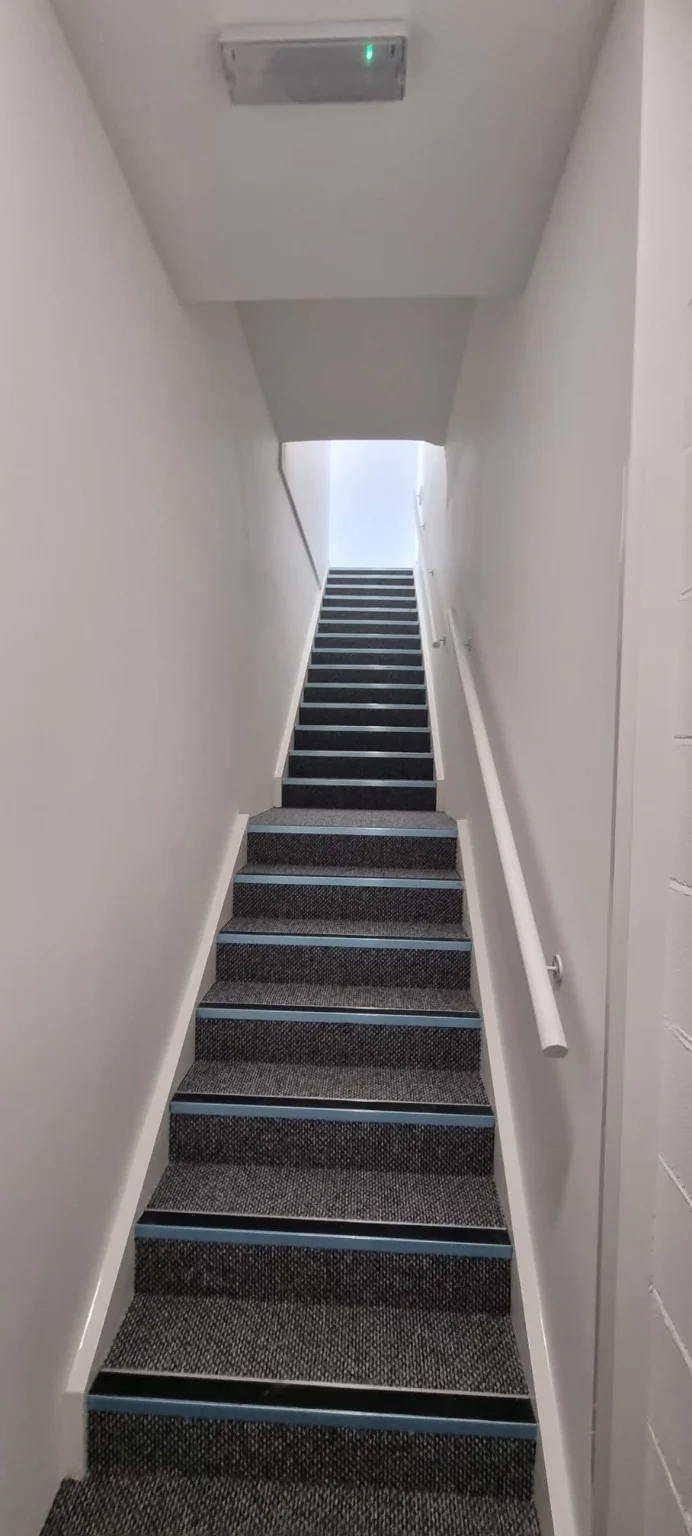 Refurbished common stairwell with new floor and wall finishes