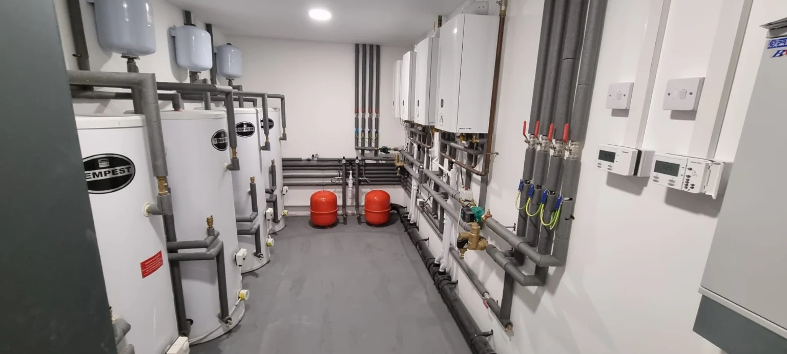 Mechanical plant room with boilers, pipework and hot water storage
