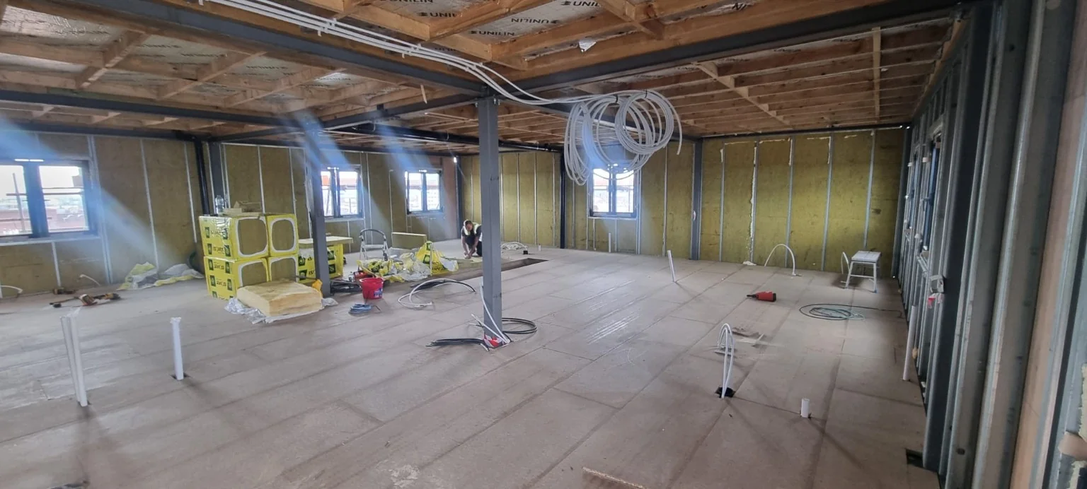 Insulated internal partition walls and first-fix services